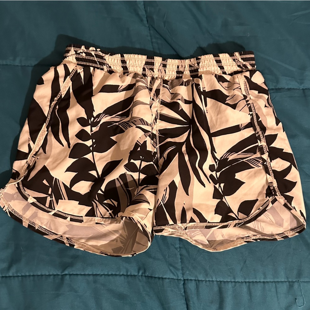 white shorts with black plants